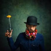 "Flower Power - Portrait of a flower bearded male" - Portrait-Fotografie von Peter Zelei als Fine Art Print