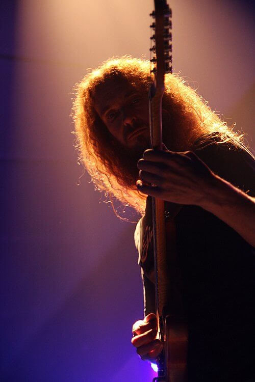 Steve Vai, Guthrie Govan, David Maxim Micic — when the electric guitar becomes a contemporary art form. Wall decoration electric guitar Guitarist Guthrie Govan on tour with Steven Wilson (2013)